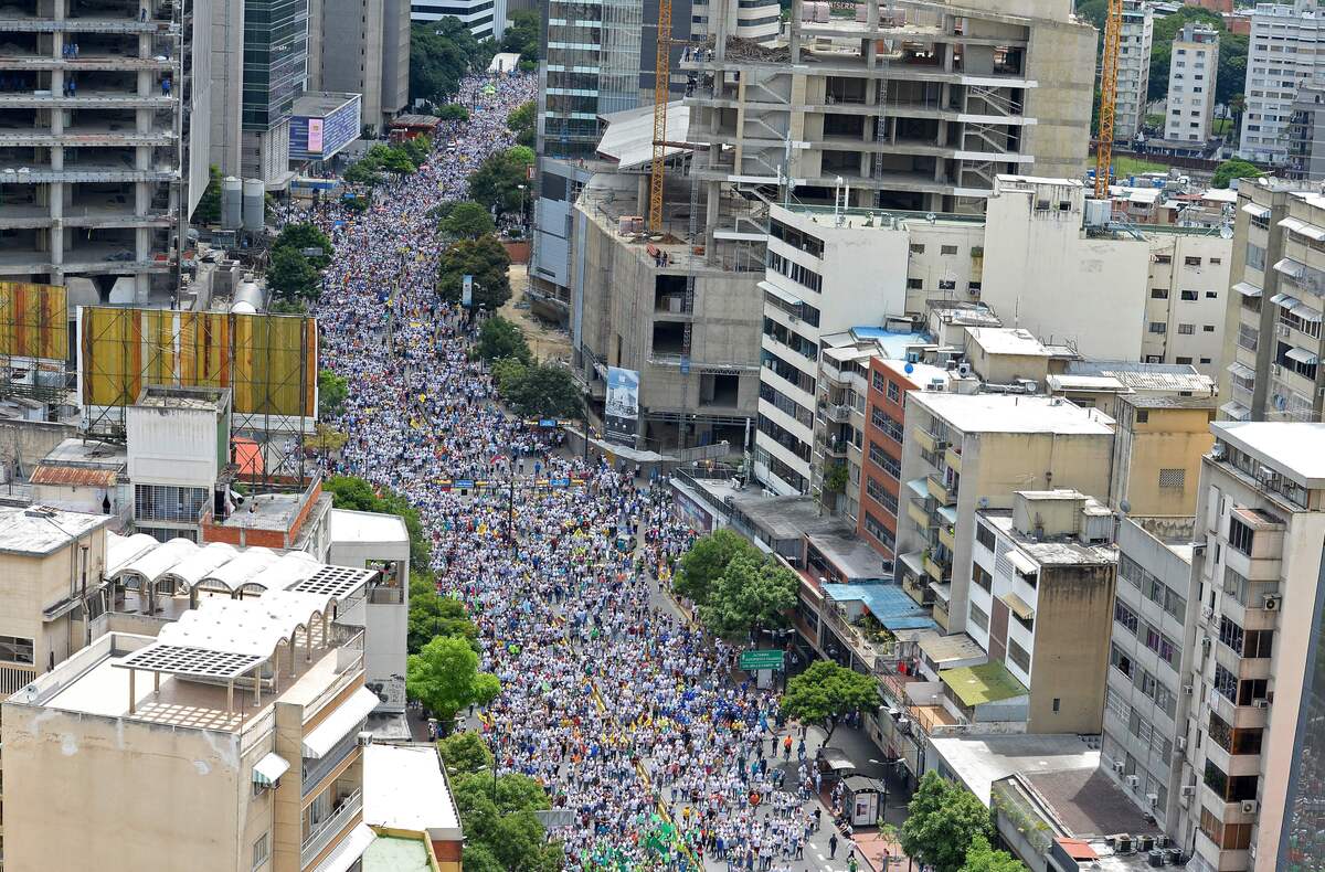 PHOTOS: Venezuelans Take To The Streets In Protest Against The ...