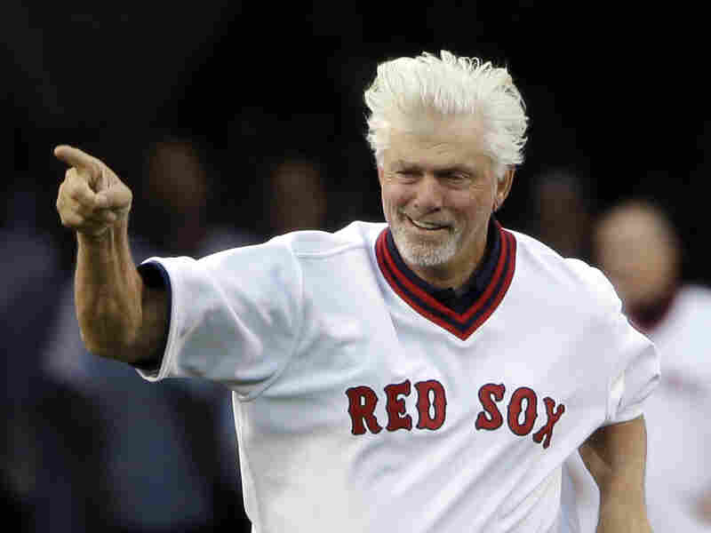 Boston Red Sox former pitcher Bill "Spaceman" Lee runs onto the field to join teammates during pre-game ceremonies at Fenway Park on May 5, 2015.