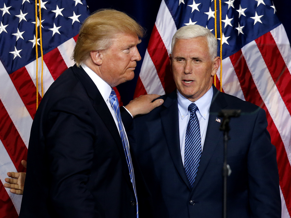 Republican presidential candidate Donald Trump (left) and vice presidential candidate Mike Pence. Pence released 10 years of his tax returns revealing a modest income. A Pence spokesman says Trump won't release his until after "a routine audit." (Ross D. Franklin/AP)