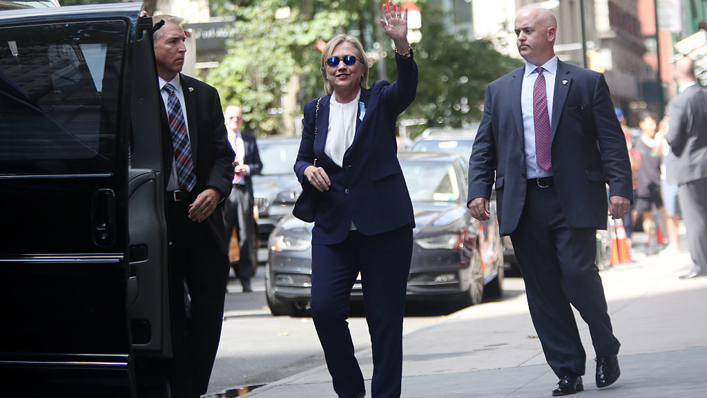 Hillary Clinton exits her daughter Chelsea Clinton's apartment on Sunday after she became sick at a Sept. 11 memorial service. Diagnosed with pneumonia, she had taken several days off the campaign trail to recover. (The Washington Post/Getty Images)