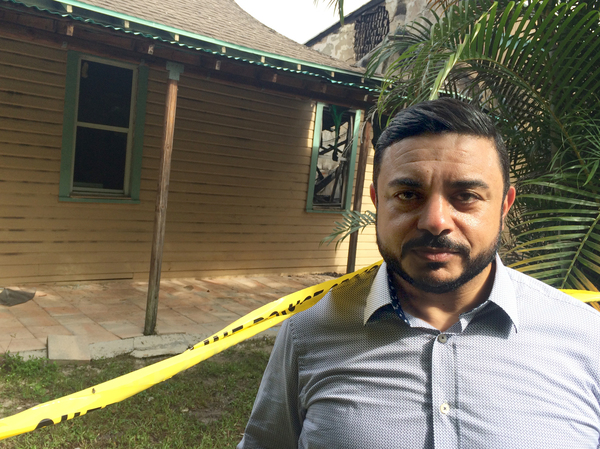 Ahmed Bedier, a Muslim community activist, stands outside the Fort Pierce mosque, damaged in arson attack this week. He says Clinton's comments were probably "unwise" but "honest."