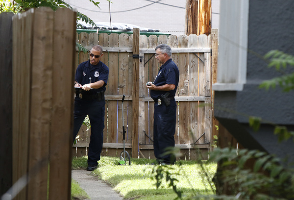 Members of the Columbus Police Crime Scene Search Unit investigate the area around the fatal police shooting of Tyre King, 13, Wednesday night.