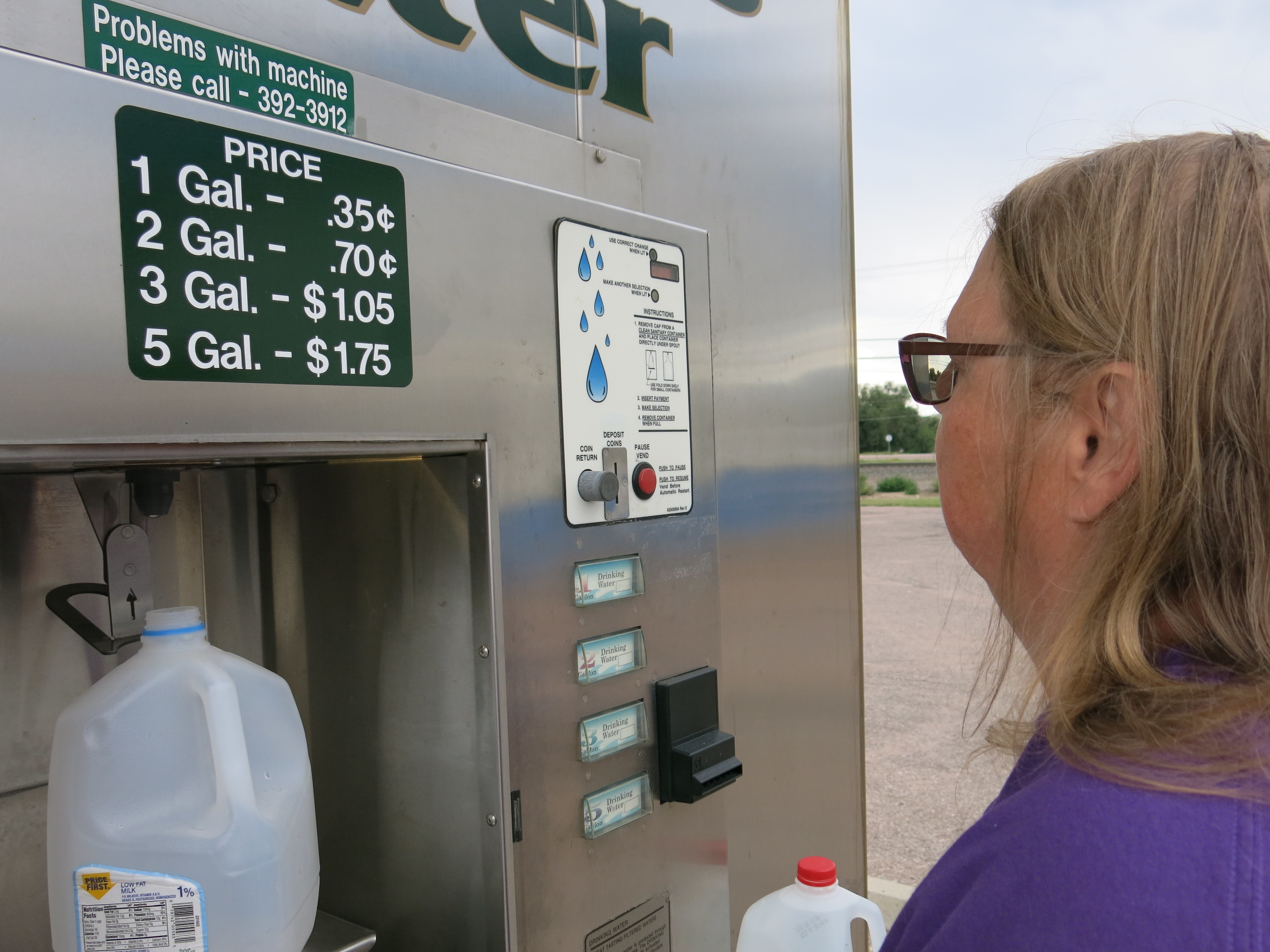 For months, Security, Colo., resident Brenda Piontkowski has regularly visited this vending station to collect drinking water for her family. (Colorado Public Radio)