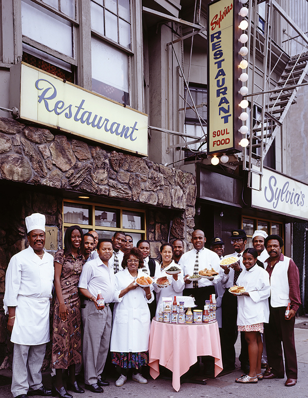 Sylvia Woods and her employees outside Sylvia's restaurant, a legendary soul-food restaurant in Harlem.