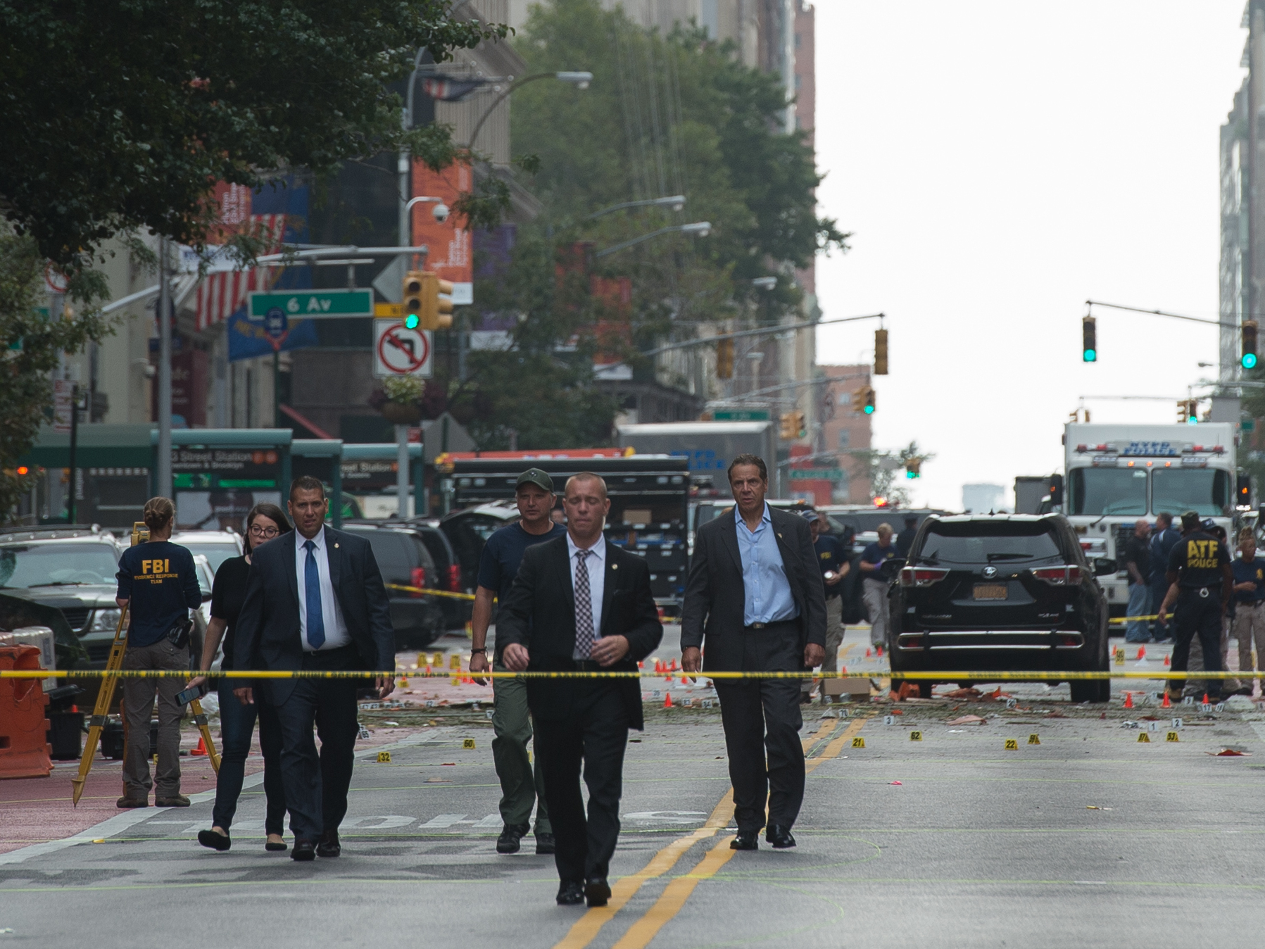 New York Governor Andrew Cuomo (R) visits the scene of an explosion on West 23rd Street Sept. 18, 2016 in New York. An explosion rocked one of the most fashionable neighborhoods of New York, injuring 29 people, one seriously, a week after America's financial capital marked the 15th anniversary of the 9/11 attacks. (AFP/Getty Images)