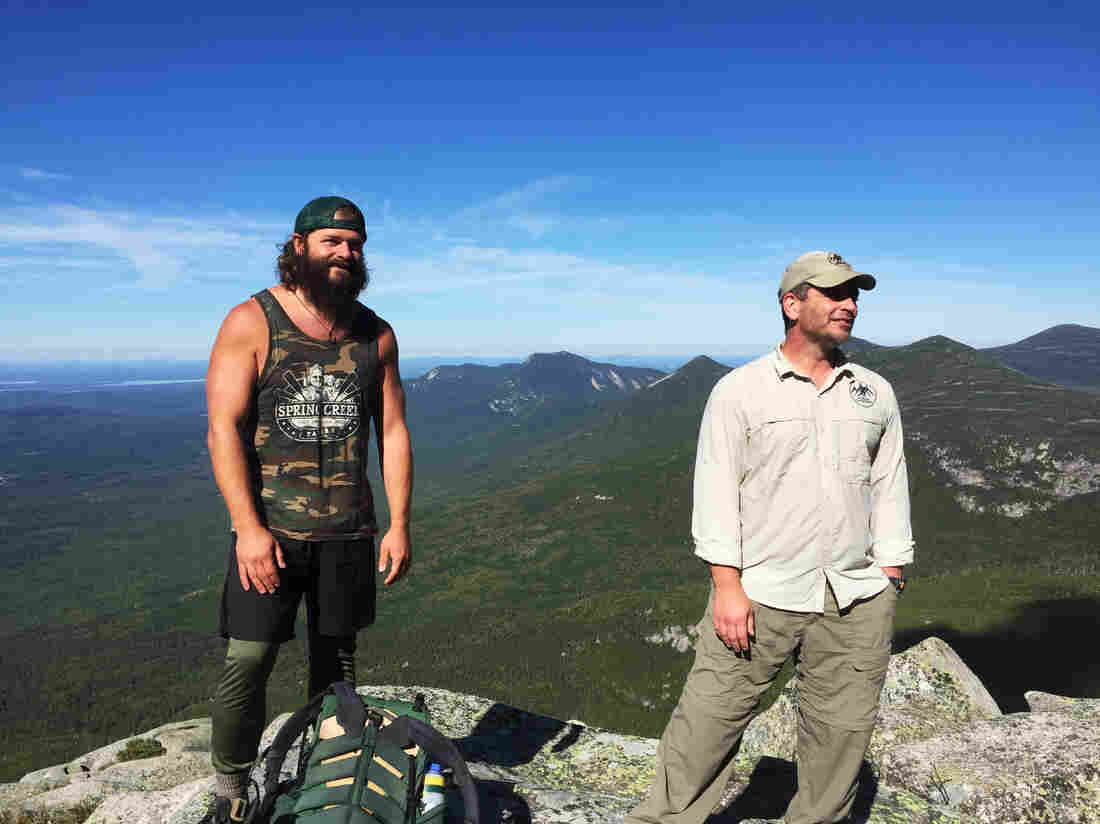 Daniel Dean (left) and Sean Gobin hike up the last few miles of the trail on Mount Katahdin in Maine. These Warrior Hikers are supported by veterans organizations.
