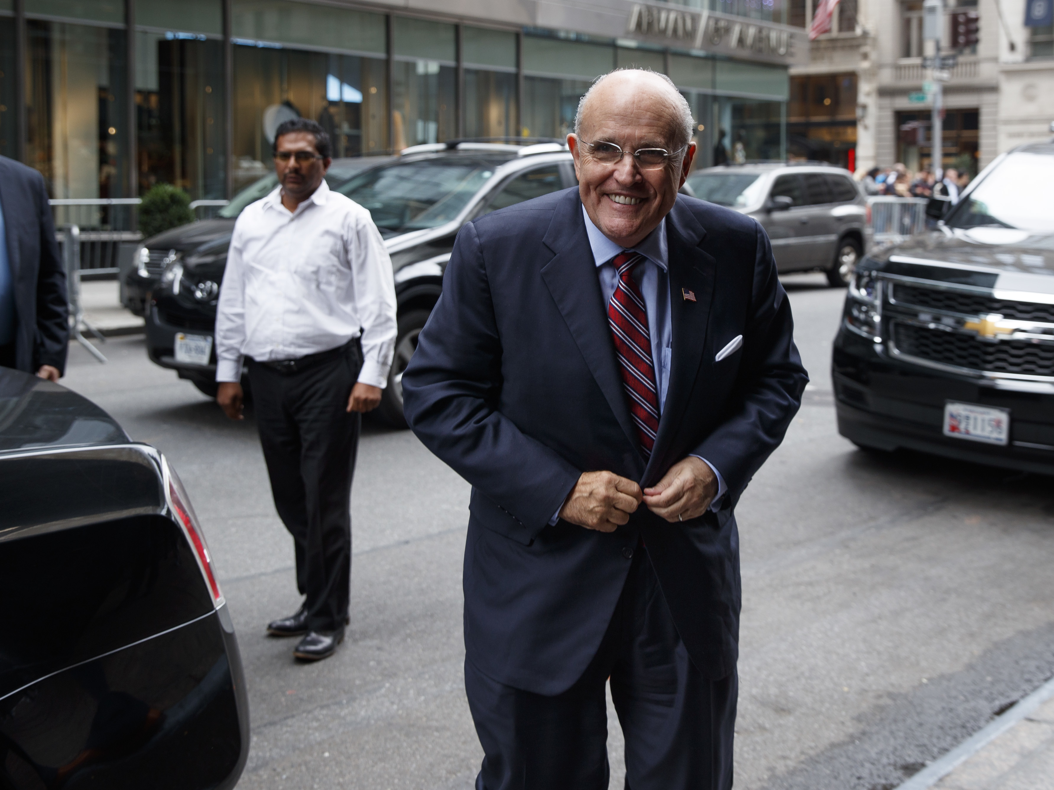 Former New York mayor Rudy Giuliani arrives at Trump Tower Saturday to strategize with Donald Trump over how to handle tapes capturing the GOP nominee making lewd statements about women