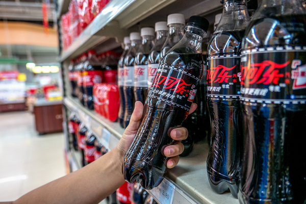 Diet Coke for sale in a Chinese supermarket. A new World Health Organization report recommends that nations adopt fiscal policies, including taxes, that raise the retail price of sugary drinks to fend off obesity and diabetes — and the health care costs that go with them.