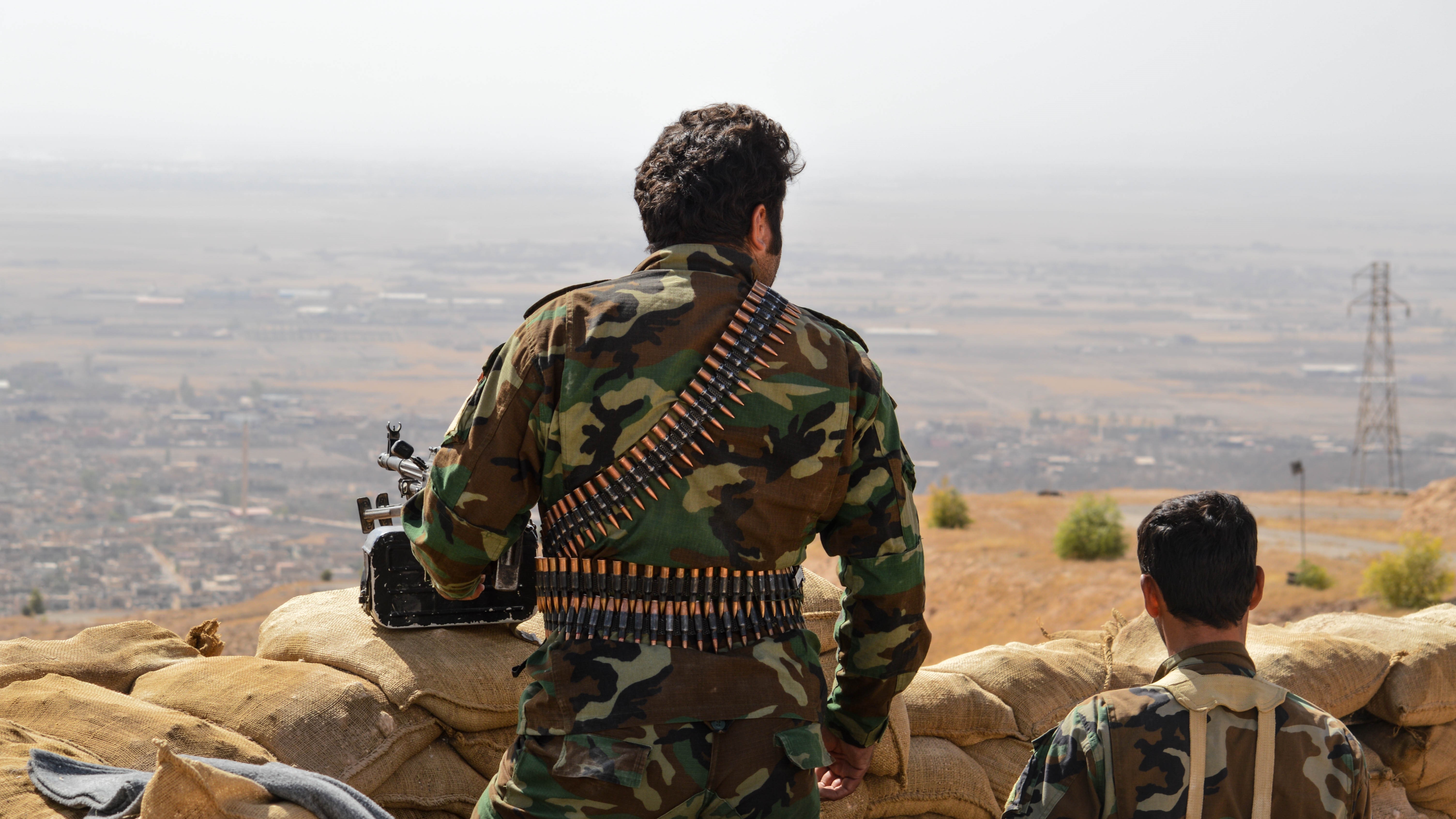 Peshmerga forces stand guard in Nineveh, Iraq as U.S. artillery units bomb ISIS positions in the east of Mosul during an operation to retake Mosul from ISIS on Oct. 15, 2016. (Getty Images)