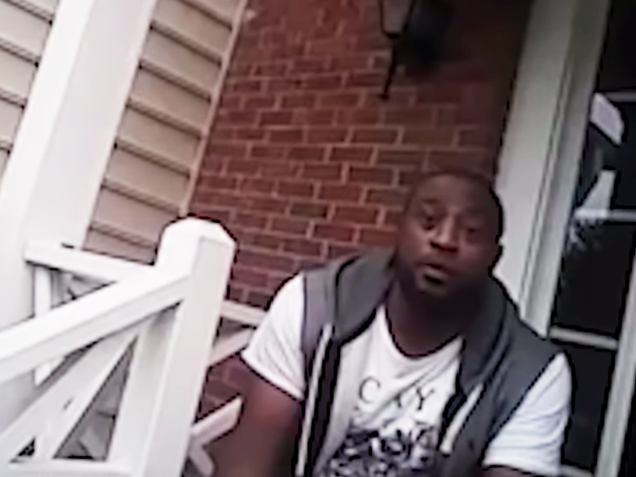 Dejuan Yourse is interviewed by police Officers Charlotte Jackson and Travis Cole in Greensboro, N.C., on June 17. (NPR via YouTube)