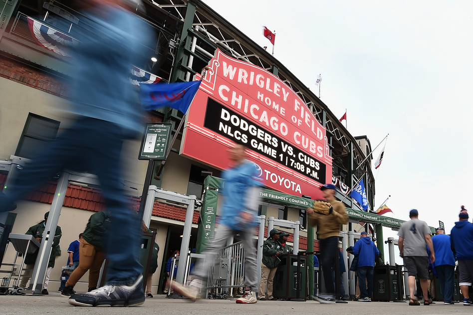 Fans walk outside Chicago's Wrigley Field prior to Game 1 of the National League Championship Series between the Chicago Cubs and the Los Angeles Dodgers on Oct. 15. (Stacy Revere/Getty Images)
