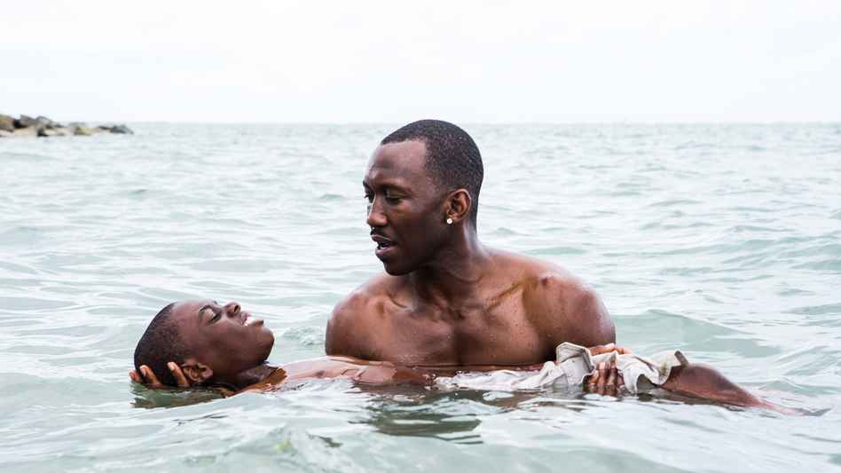 Juan (played by Mahershala Ali) teaches Chiron (Jaden Piner) how to swim in <em>Moonlight</em>. The film is told with different actors playing Chiron at different stages of his life. (David Bornfriend/A24 Films)