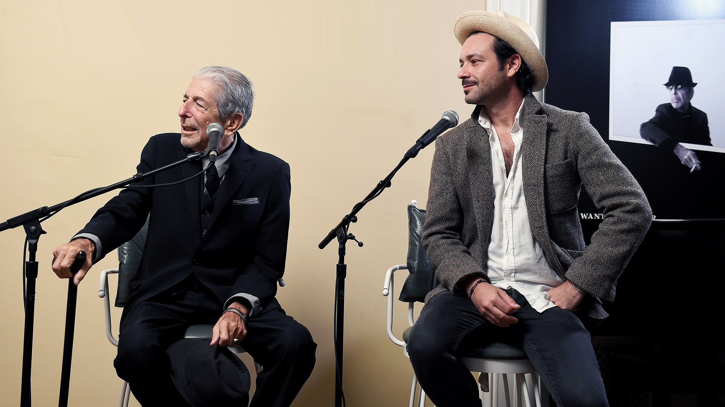 Leonard Cohen (left) and Adam Cohen speak at an event for the release of <em>You Want It Darker</em>. (Courtesy of the artist)