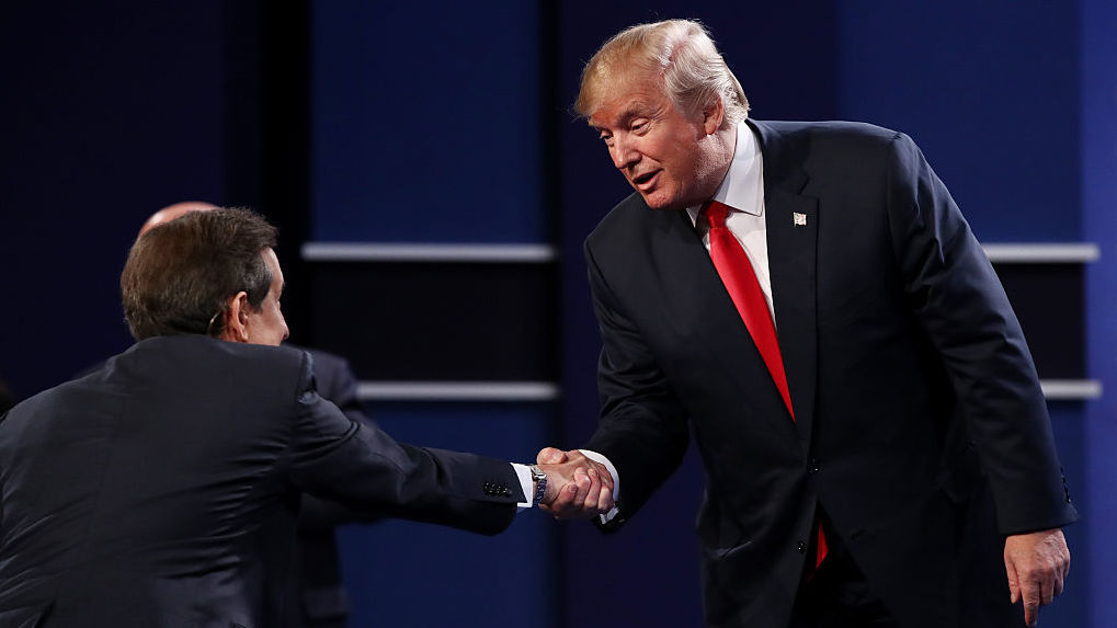 Republican presidential nominee Donald Trump shakes hands with Fox News anchor and moderator Chris Wallace after the third presidential debate. (Getty Images)