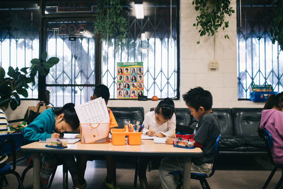 Students at Las Familias Del Pueblo, an after-school program in Los Angeles, practice sentence structure and language. (Morgan Walker for NPR)