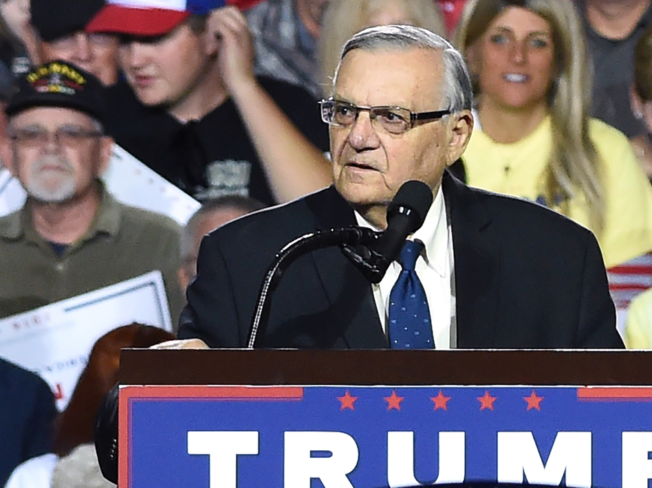 Sheriff Joe Arpaio, seen here at a rally for Republican presidential candidate Donald Trump earlier this month, is now facing criminal charges from federal prosecutors over his immigration patrols. (Robyn Beck/AFP/Getty Images)