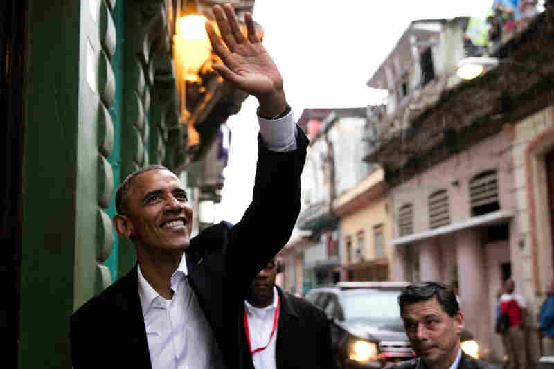 President Obama waves to people as he enters a restaurant in Havana, Cuba on Mar. 20, 2016. His trip to Cuba is the first time an American president had visited the island since 1928.