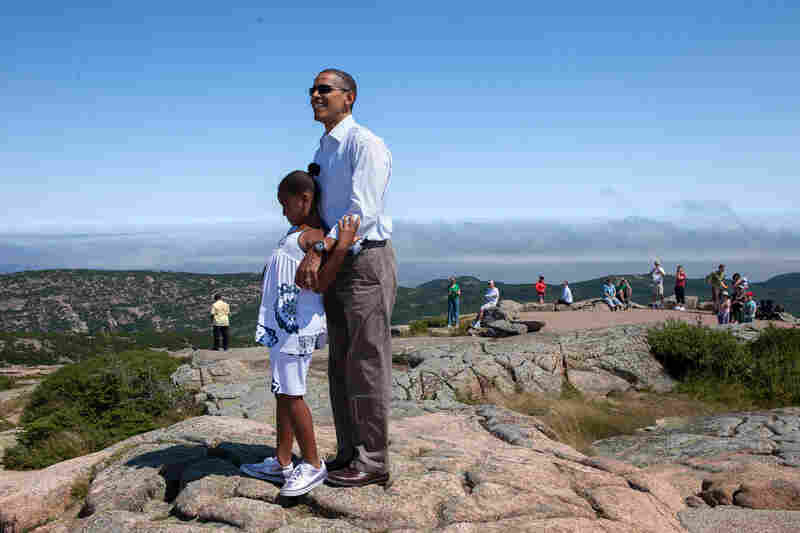 President Obama stands with his daughter, Sasha, on Cadillac Mountain in Acadia National Park, Maine in July 2010.