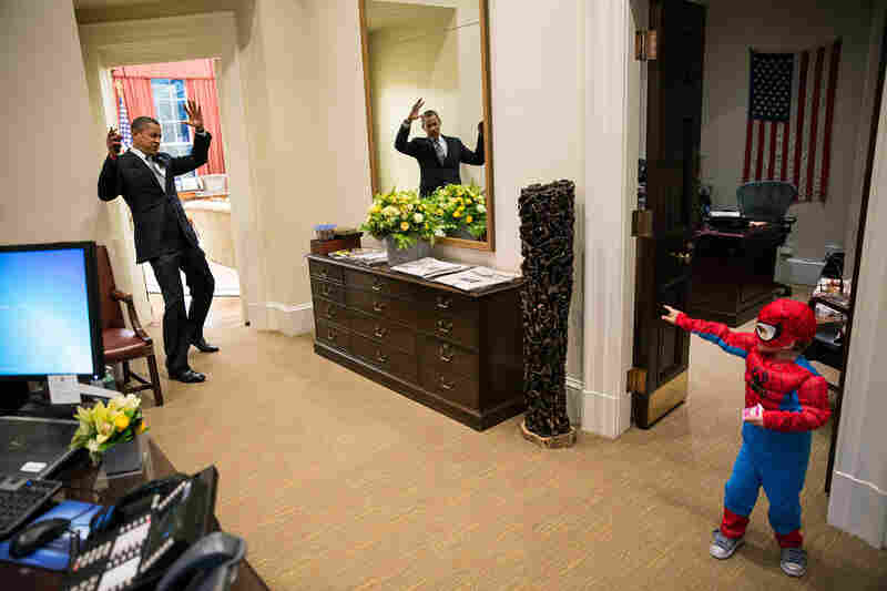President Obama reacts as Nicholas Tamarin, 3, greets him with Spider Man's web in October 2012. On The White House Flickr page, Souza said, "I can never commit to calling any picture my favorite, but the President told me that this was his favorite picture of the year when he saw it hanging in the West Wing a couple of weeks later."
