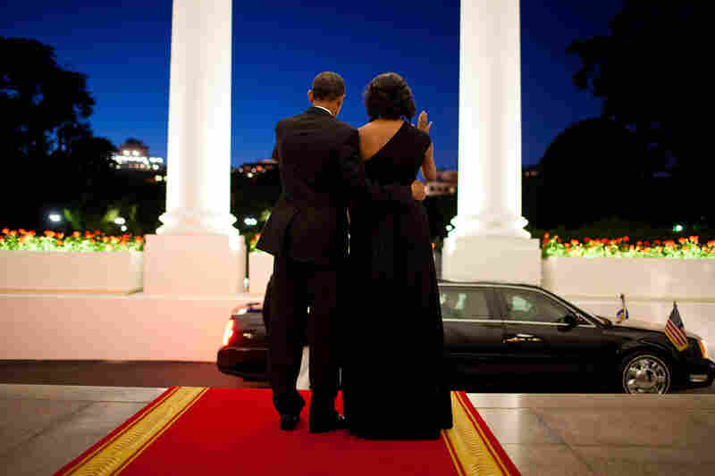 President Obama and first lady Michelle Obama wave goodbye to President Shimon Peres of Israel following a dinner in his honor at the White House in June 2012.