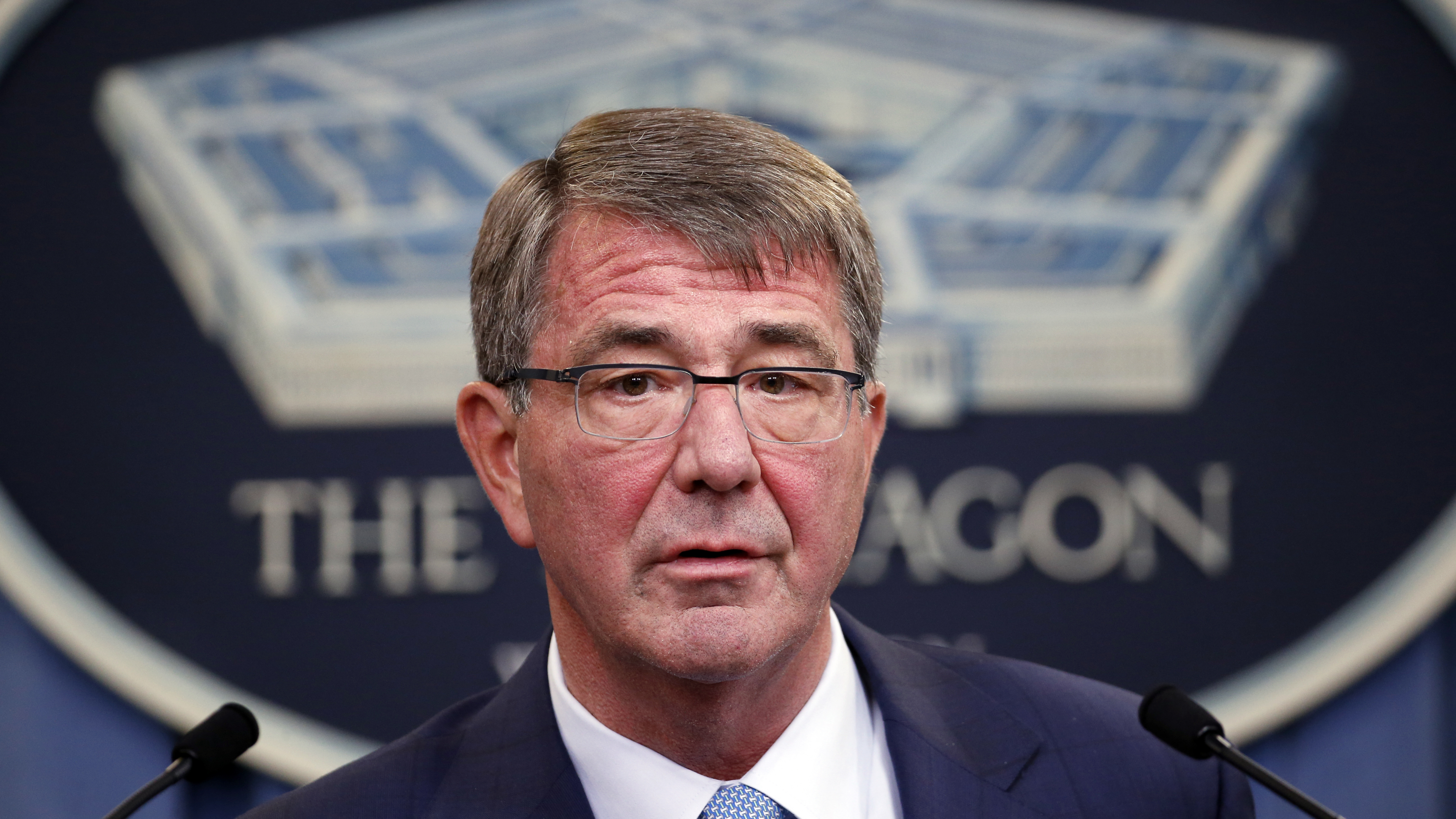 U.S. Defense Secretary Ash Carter, pictured at a June news conference, said the Pentagon ultimately "will provide for a process that puts as little burden as possible on any soldier who received an improper payment through no fault of his or her own."