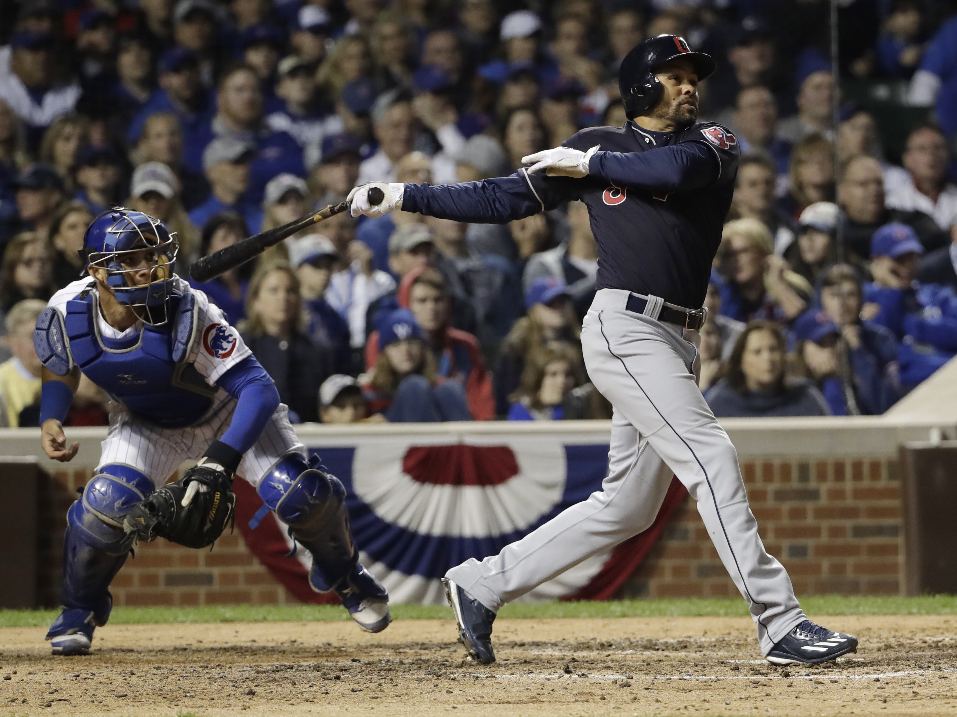 Cleveland's Coco Crisp hits the RBI single that allowed the Indians to beat the Cubs 1-0 in Game 3 of the World Series in Chicago on Friday. Cleveland leads the Series two games to one.