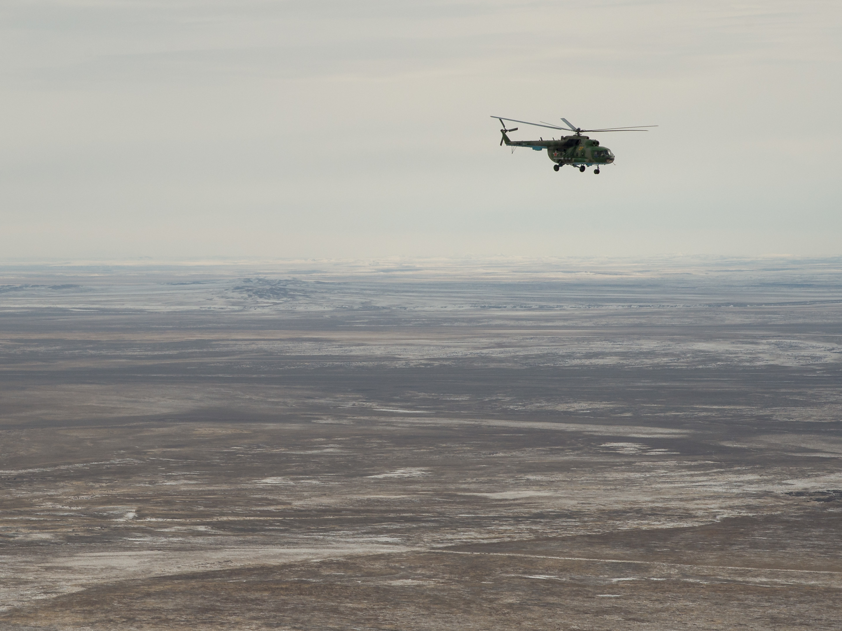 Russian search and rescue teams fly over Kazakhstan as they prepare for the Soyuz MS-01 landing on Sunday. Bill Ingalls/NASA.