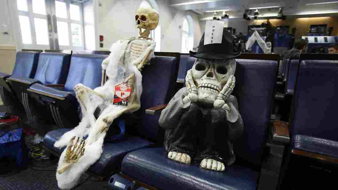 "Journalists" Halloween decorations sit in the briefing room of the White House.