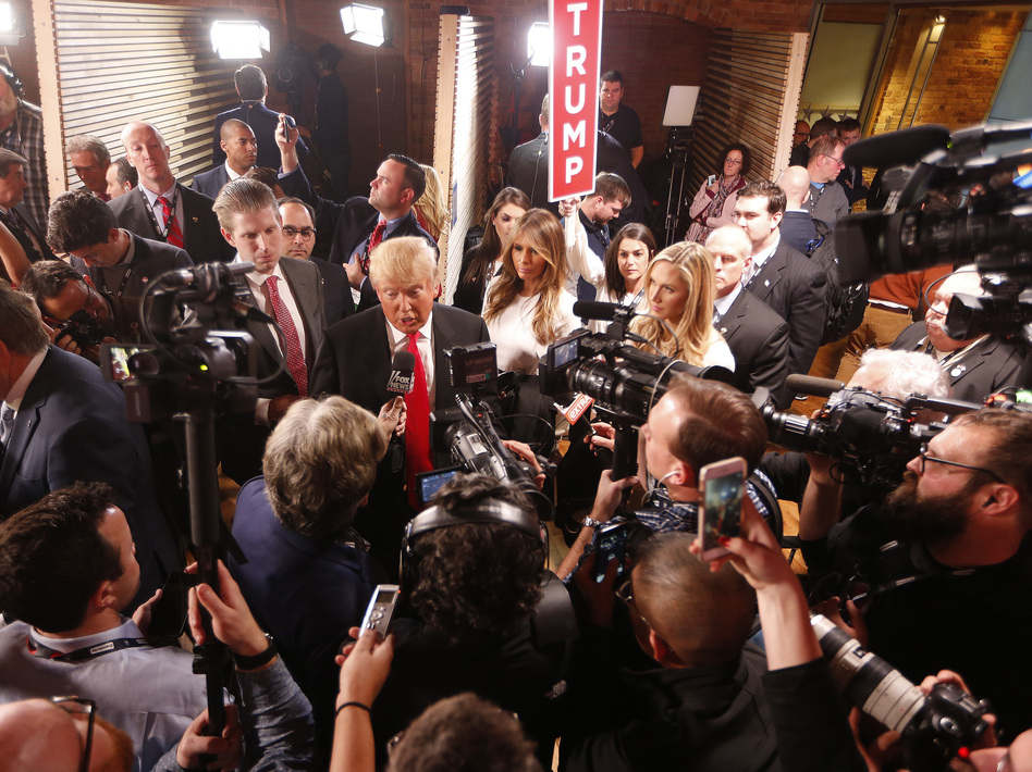 Donald Trump speaks to members of the media in the spin room after the Republican presidential debate Feb. 13, in Greenville, S.C. (John Bazemore/AP)