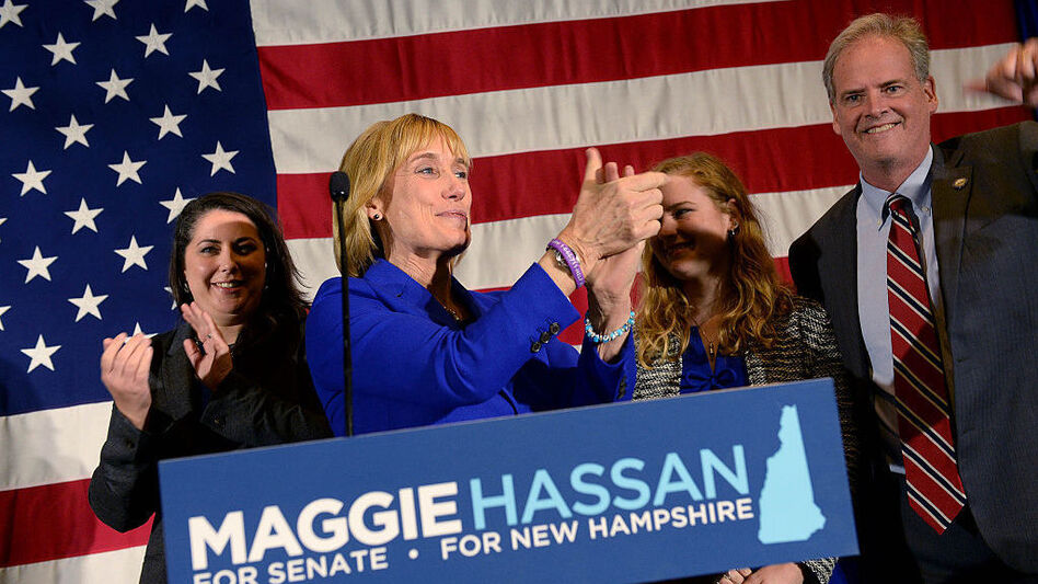 New Hampshire Gov. Maggie Hassan took the stage with her family to thank supporters on Tuesday night. (Darren McCollester/Getty Images)
