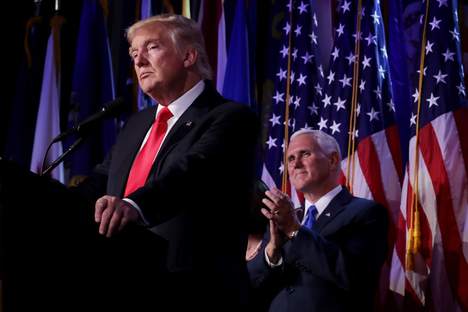 Republican president-elect Donald Trump delivers his acceptance speech as Vice president-elect Mike Pence looks on during his election night event at the New York Hilton Midtown in the early hours of Wednesday morning. (Chip Somodevilla/Getty Images)