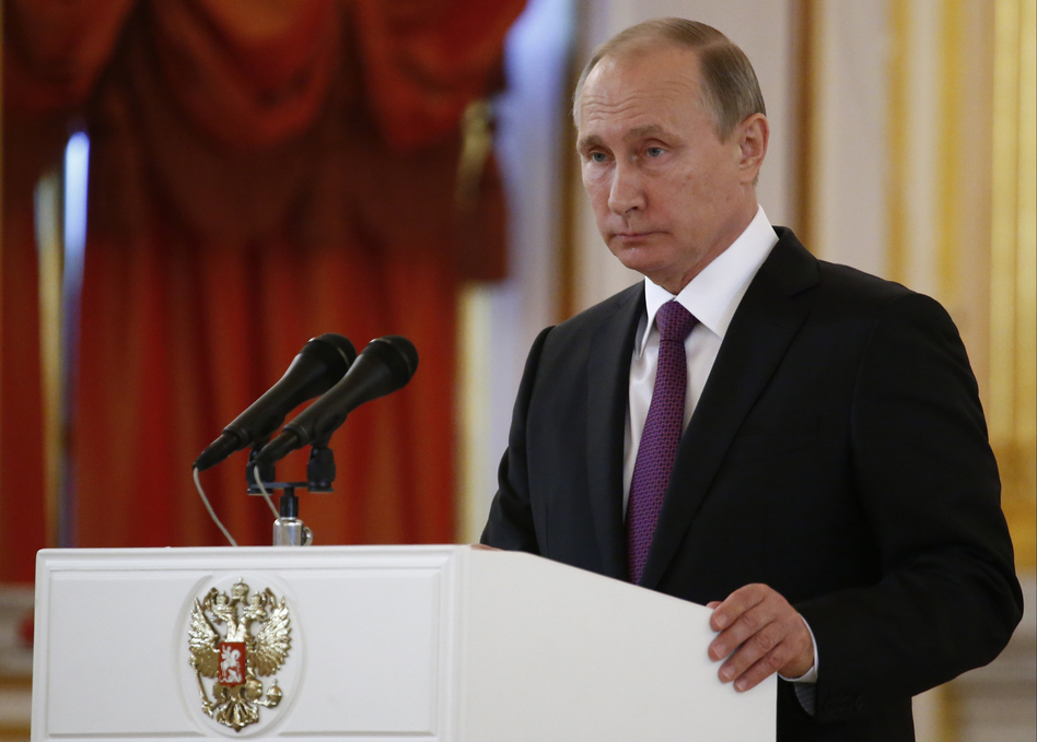 Russian President Vladimir Putin speaks at the Kremlin on Wednesday. Putin says that Moscow hopes to restore good relations with the United States in the wake of the election of Donald Trump. (Sergei Karpukhin/AP)