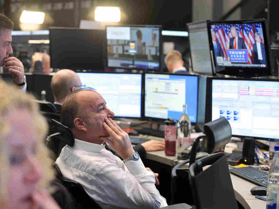 Traders watch the speech of Donald Trump, after he wins the U.S. presidential elections, at the Frankfurt Stock Exchange on November 9, 2016 in Frankfurt, Germany.