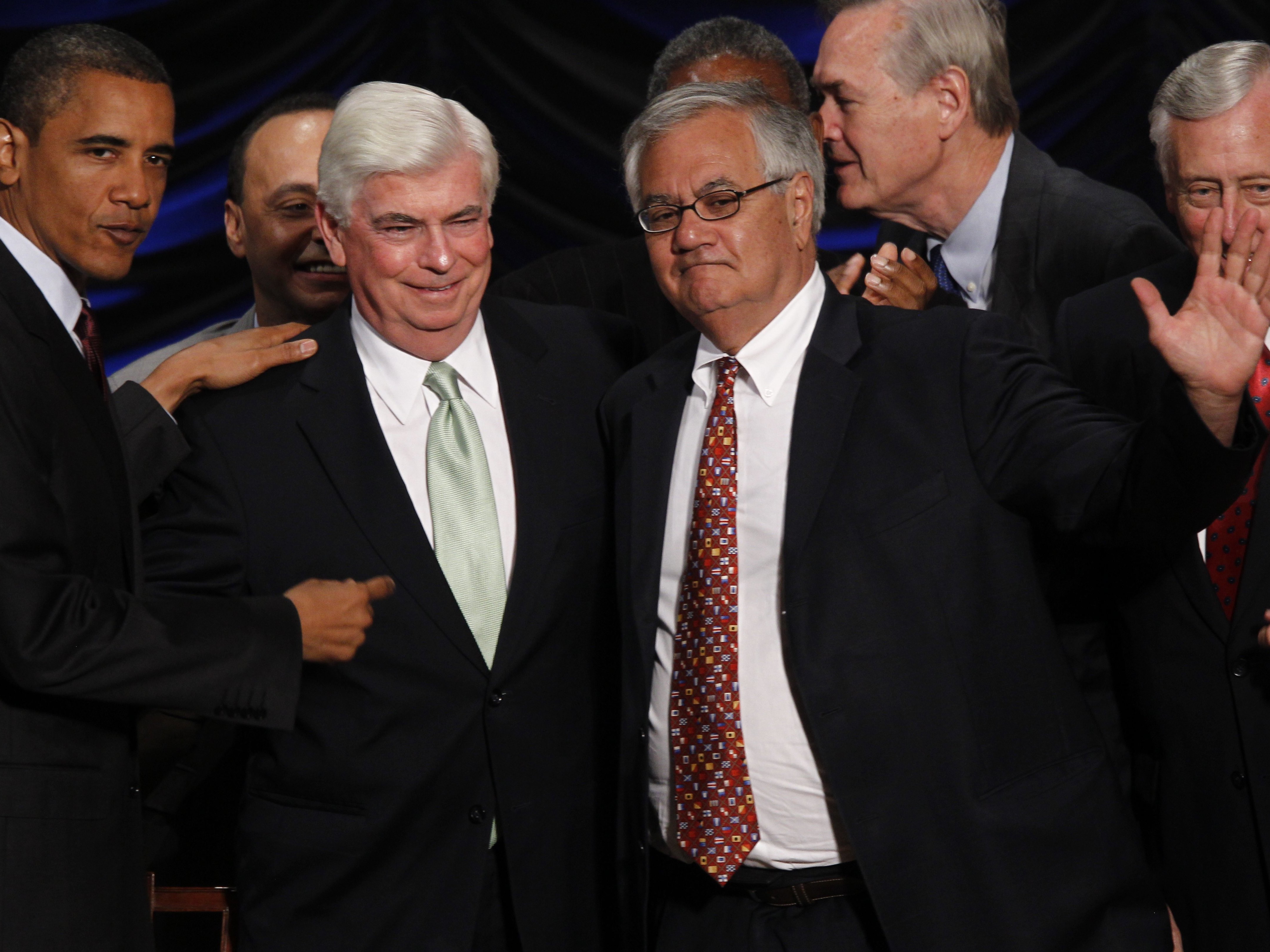 Sen. Chris Dodd and Rep. Barney Frank celebrate as their Dodd-Frank banking regulation bill is signed into law in 2010. President-elect Donald Trump has said he is interested in doing away with it.