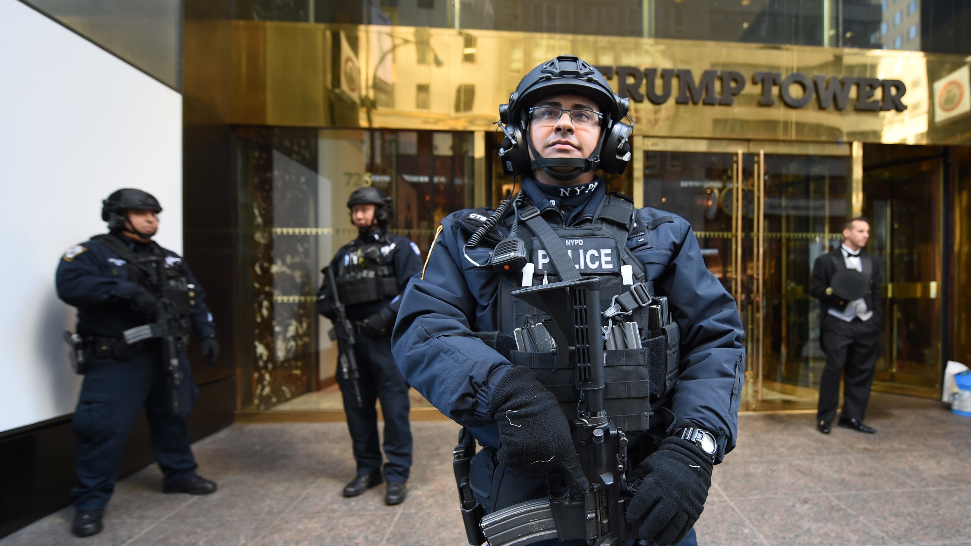 A member of the New York Police Department stands in front of Trump Tower to provide security to U.S. President-elect Donald Trump on Thursday in New York. (AFP/Getty Images)