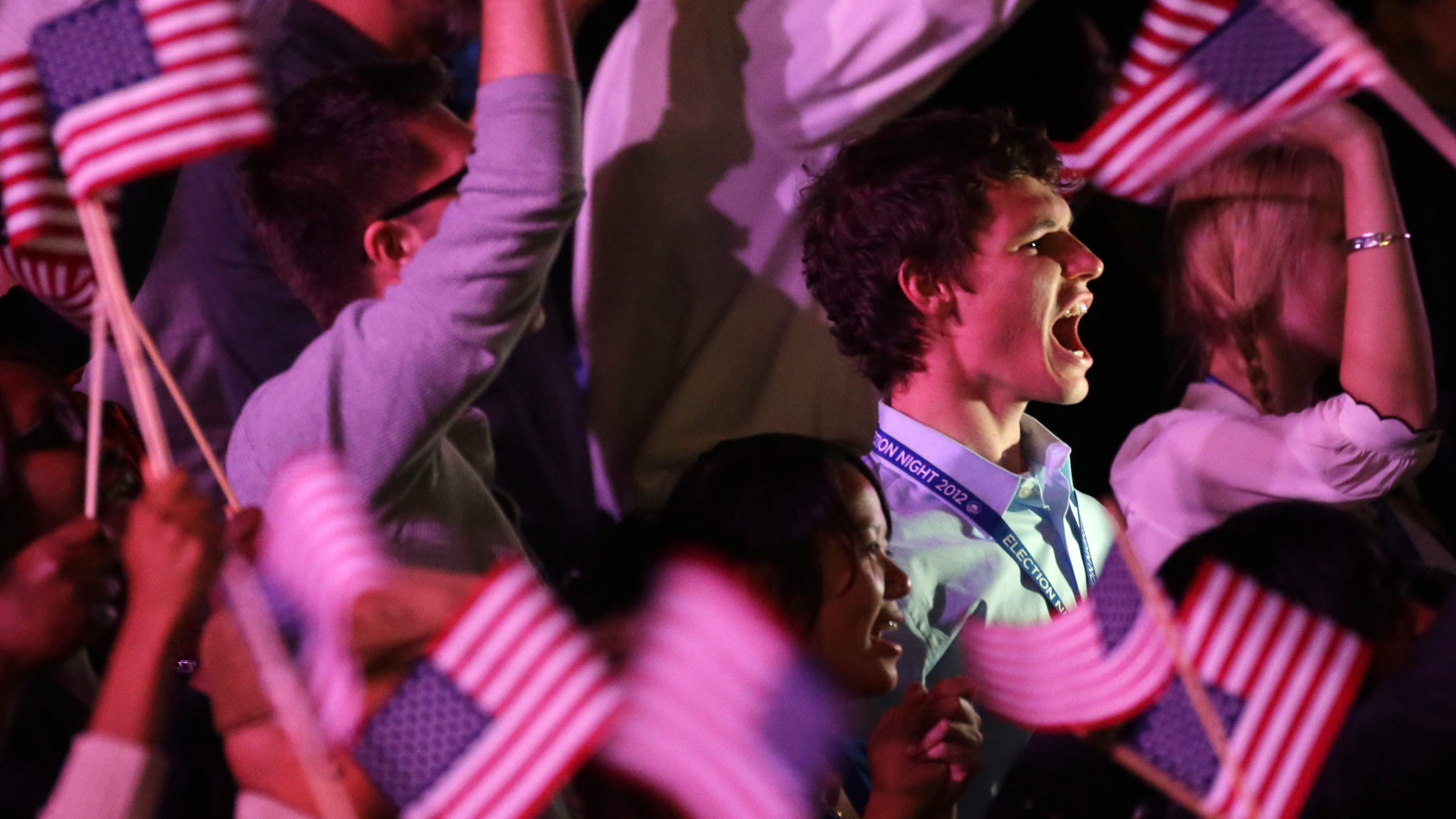 Young supporters cheer as they wait for President Obama at his election night party in 2012 in Chicago.