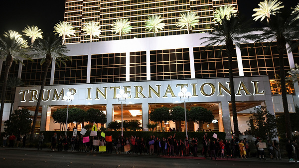 Anti-Donald Trump protesters stand in front of the Trump International Hotel & Tower in Las Vegas Saturday. The new president-elect says he'll follow through on building a wall — and deporting millions of people.