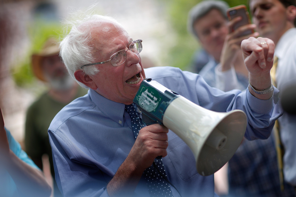 Democratic presidential candidate Sen. Bernie Sanders speaks to an overflow crowd through a megaphone after a campaign event May 27, 2015, at New England College in Concord, N.H. (Win McNamee/Getty Images)