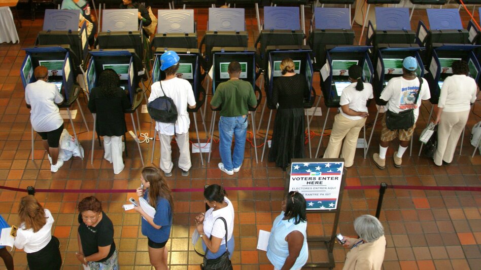 Miami voters make their choices at touch-screen voting machines. (Jeff Greenberg/UIG via Getty Images)