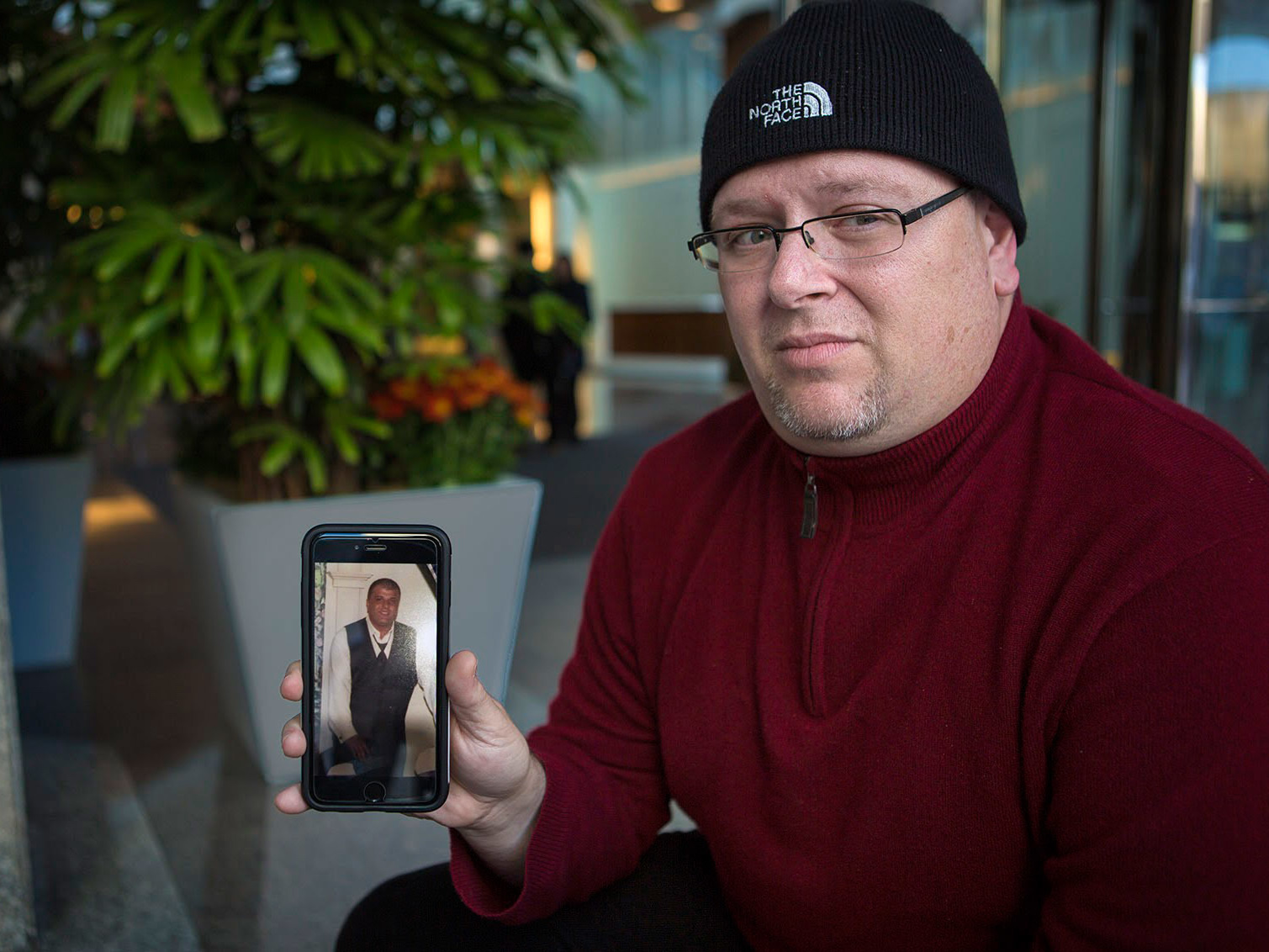 Anthony Salemi, of Everett, Mass., holds a photo of his brother Joe, who died from an overdose of fentanyl-laced heroin earlier this year.