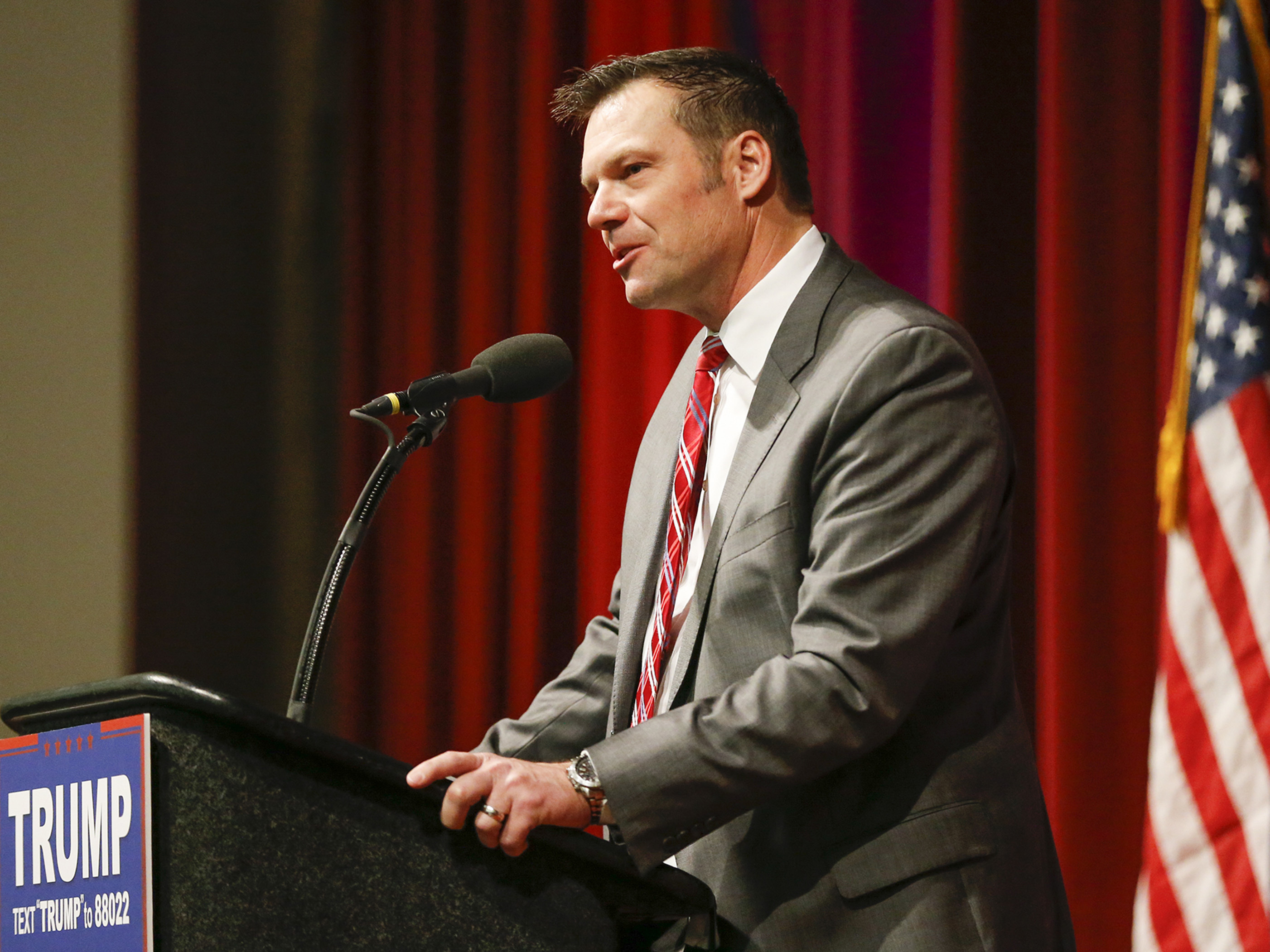 Kansas Secretary of State Kris Kobach supports Donald Trump during a rally in Wichita, Kan. (TNS via Getty Images)