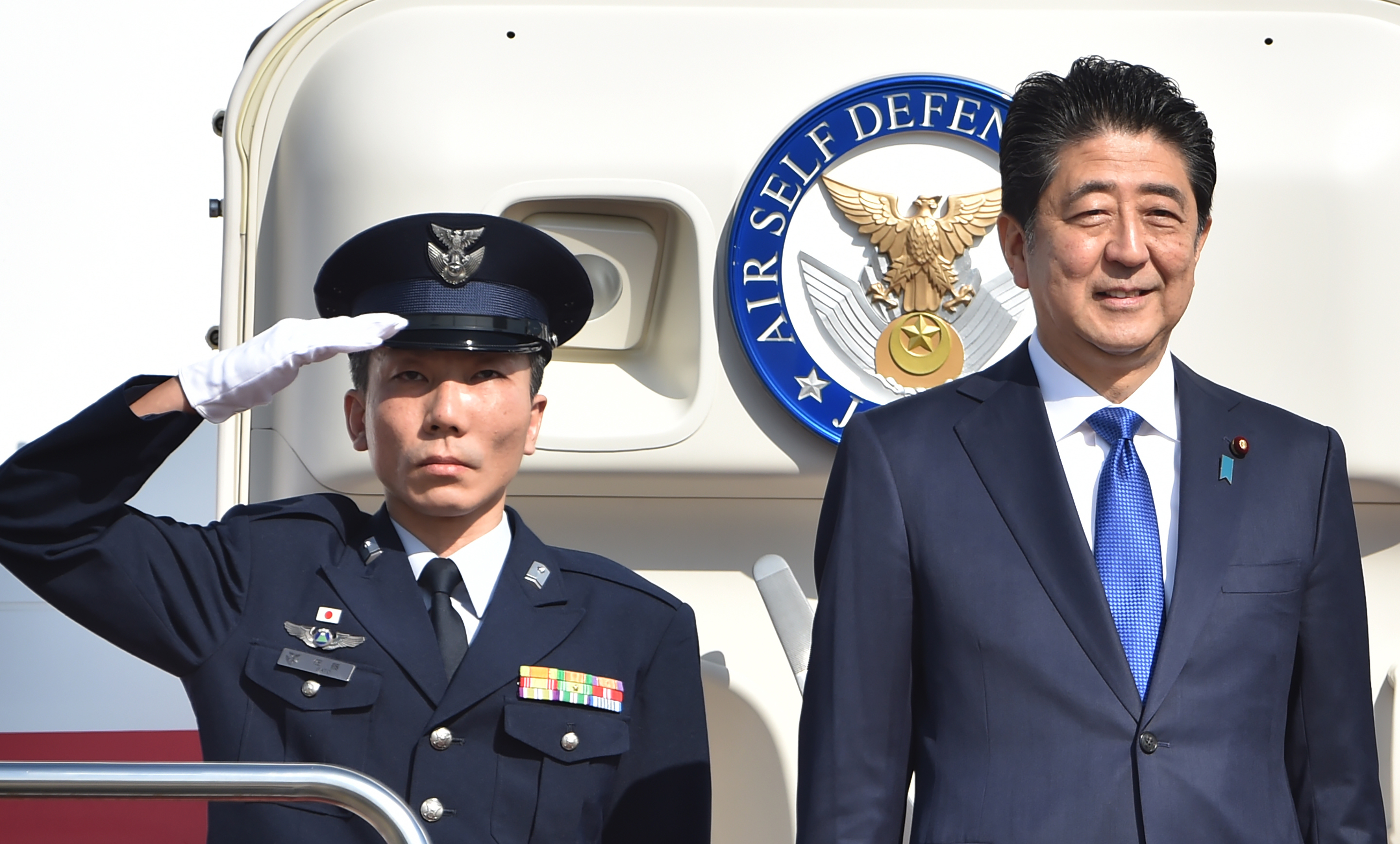 Japan's Prime Minister Shinzo Abe left Tokyo Thursday for New York, for talks with Donald Trump. He is the first foreign leader to meet with the president-elect, whose campaign pledges have prompted concerns over U.S. foreign policy. (AFP/Getty Images)