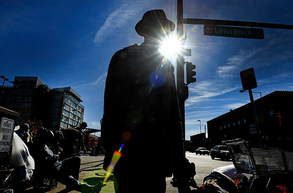 People in Denver line the sidewalks near the Denver Rescue Mission in October.