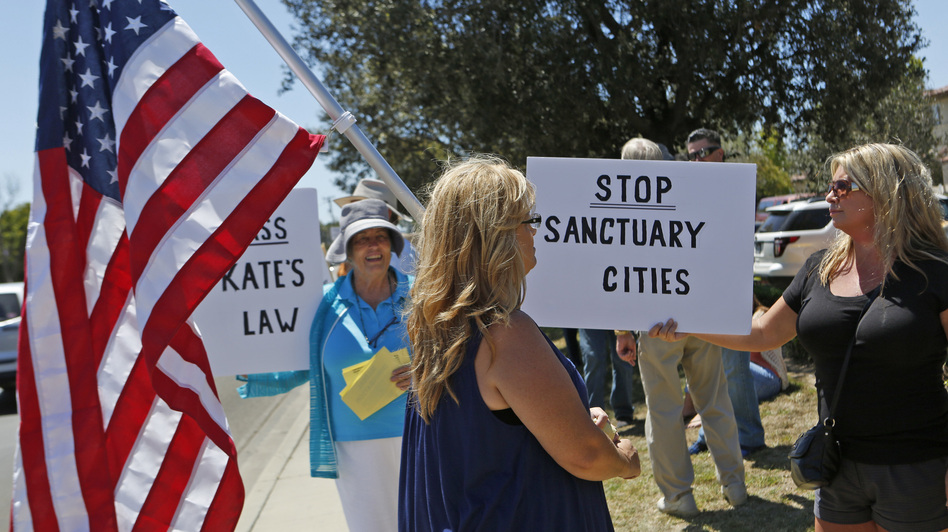 Carmen Spoerer, right, rallies among others protesting against sanctuary cities near the Santa Maria courthouse in Santa Maria, Calif. on Aug. 13. (Anne Cusack/Los Angeles Times via Getty Images)