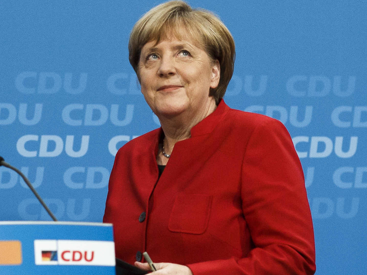 German Chancellor Angela Merkel arrives at a news conference where she announced her plan to run for a fourth term next year. Merkel is the leader of the conservative German Christian Democrats party.
