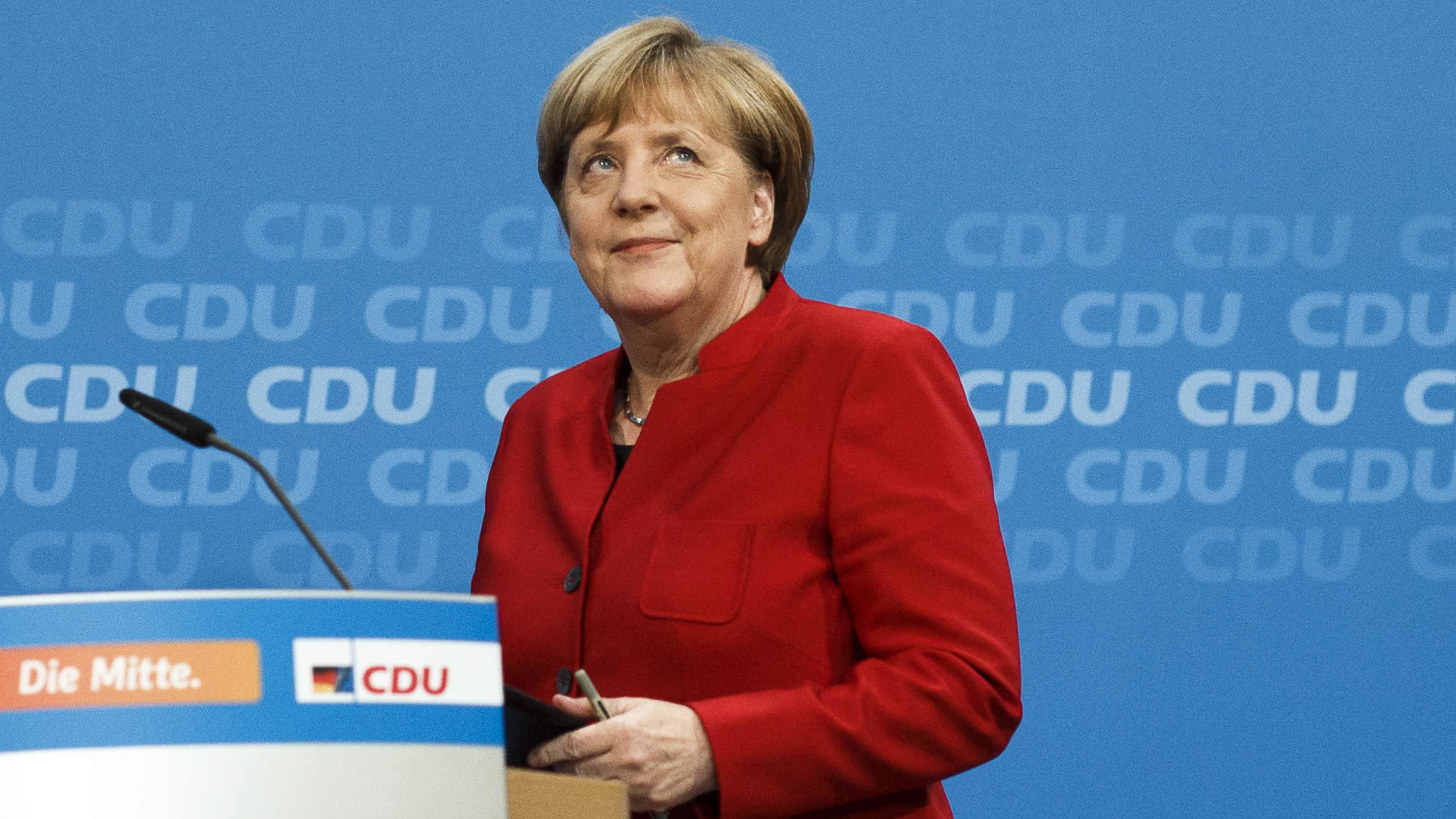 German Chancellor Angela Merkel arrives at a news conference where she announced her plan to run for a fourth term next year. Merkel is the leader of the conservative German Christian Democrats party.