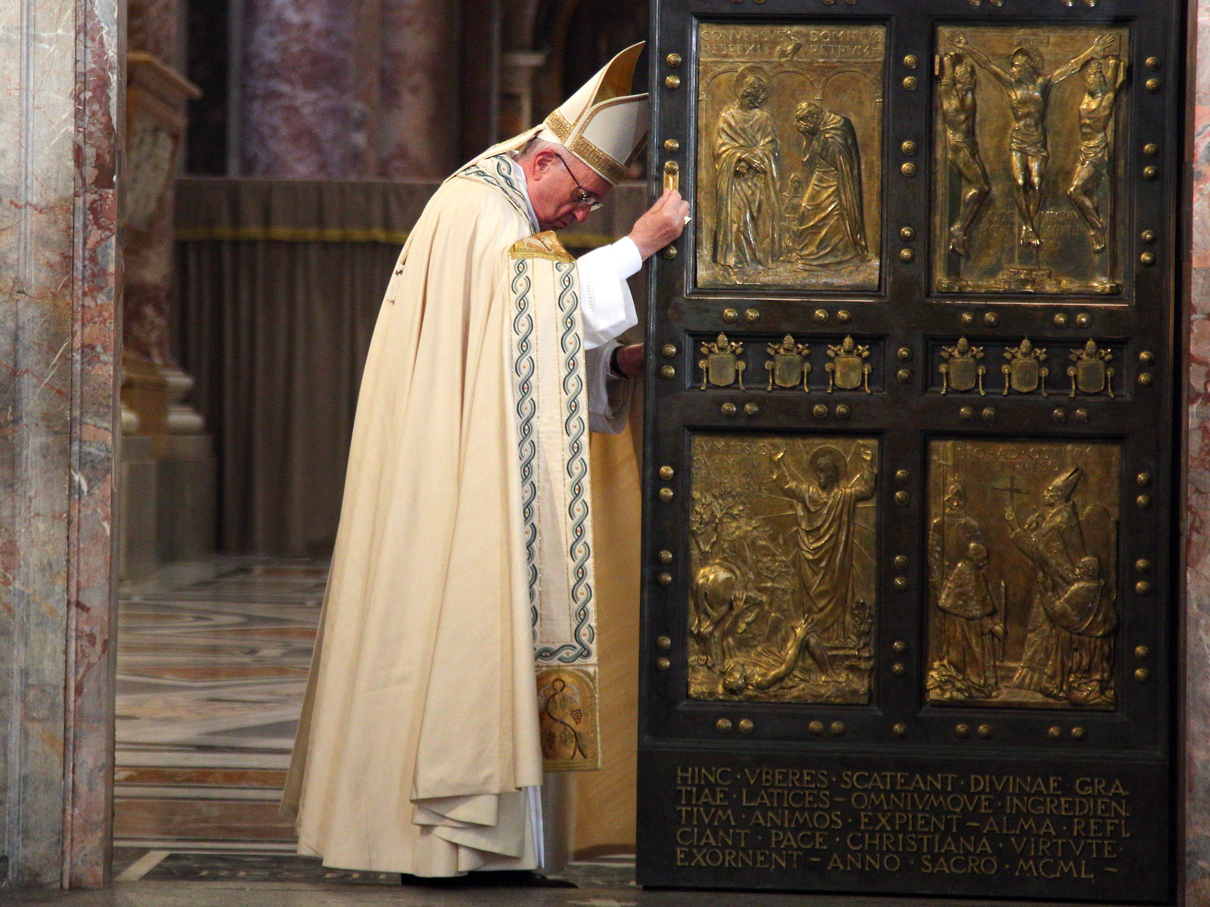 Pope Francis closes the Holy Door in St. Peter's Basilica on Sunday in Vatican City, marking the end of the Jubilee Year of Mercy. (Getty Images)