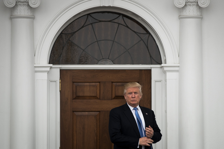 President-elect Donald Trump stands outside the clubhouse following his meeting with Peter Kirsanow, an attorney and member of the U.S. Commission on Civil Rights, at Trump International Golf Club, Sunday in Bedminster, N.J. (Drew Angerer/Getty Images)