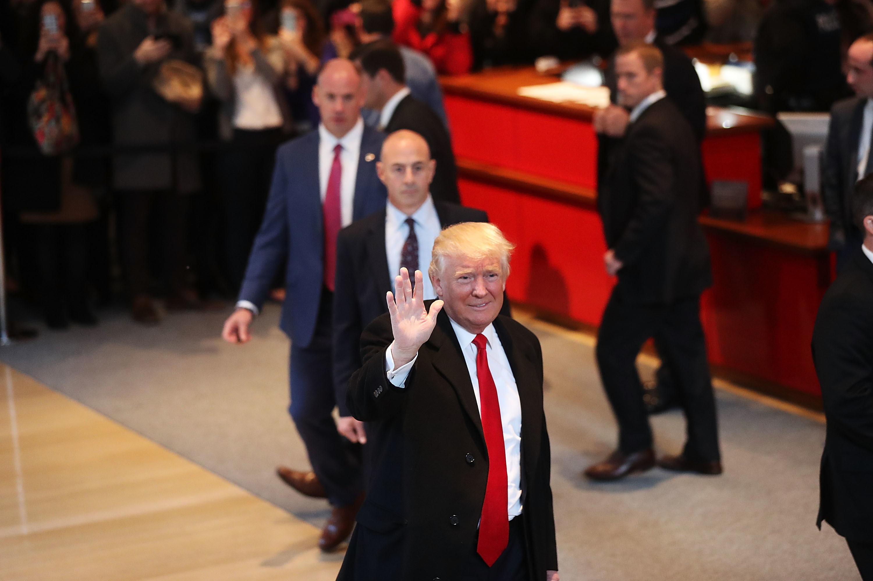 President-elect Donald Trump walks through the lobby of the New York Times following a meeting with editors at the paper on Tuesday in New York City. (Getty Images)