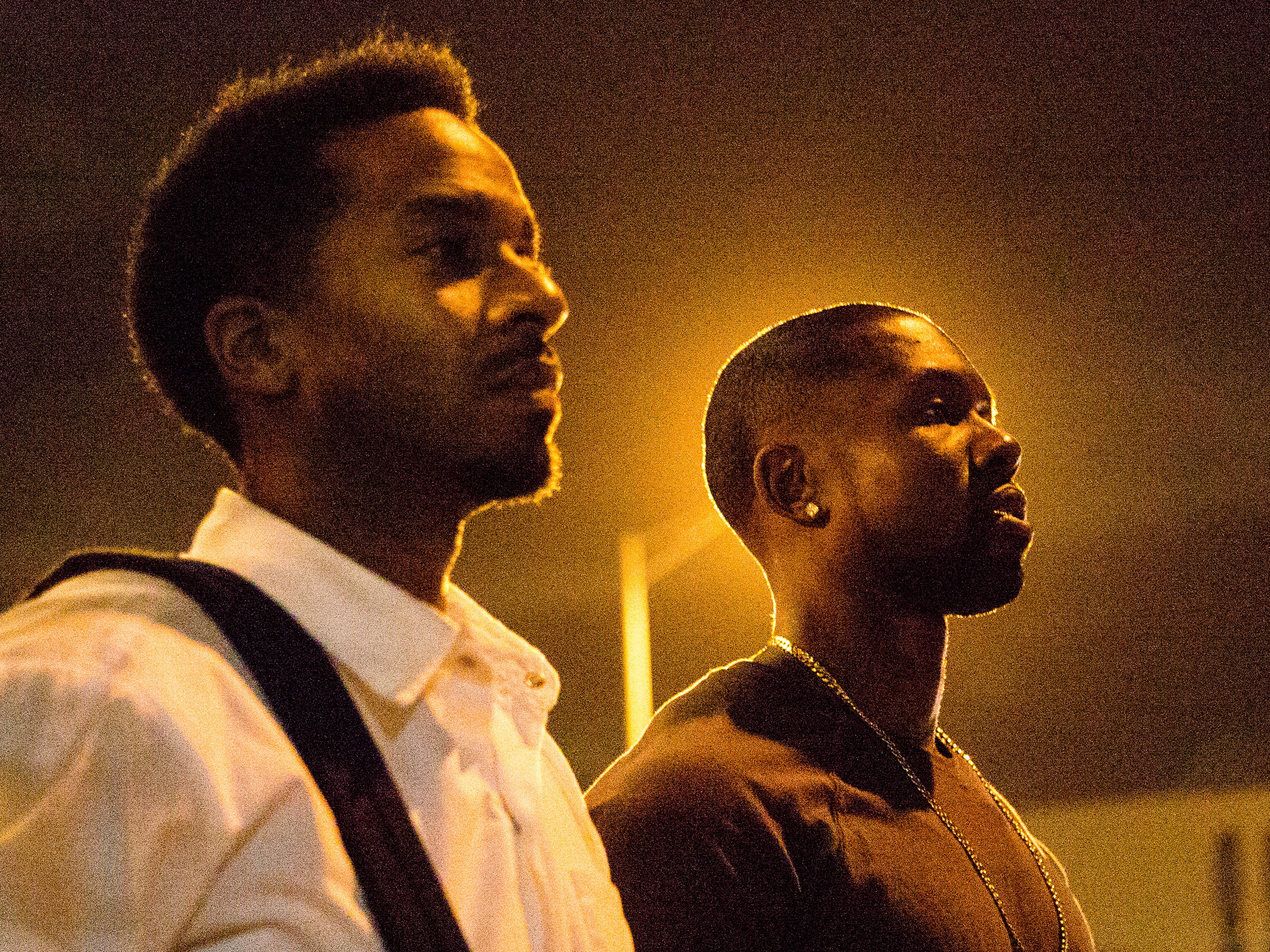 Kevin (Andre Holland, L) and Chiron (Trevante Rhodes, R) walk through the longest parking lot in the world in <em>Moonlight</em>. (A24)